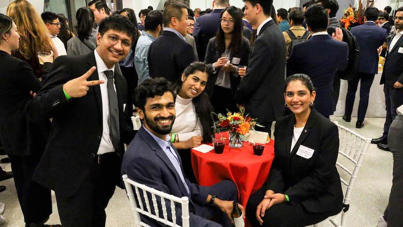 Columbia Engineering graduate students and alumni around a table at Graduate Students Connect