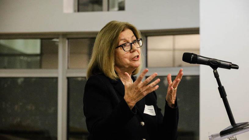 Columbia Engineering Board of Visitors Officer Georgia Papathomas speaks at the podium at Graduate Students Connect
