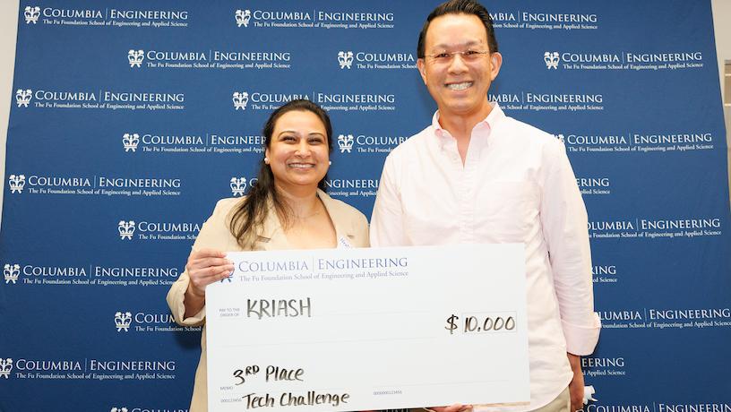 Kriash team lead Neetika Ashwani accepting their $10,000 third place award