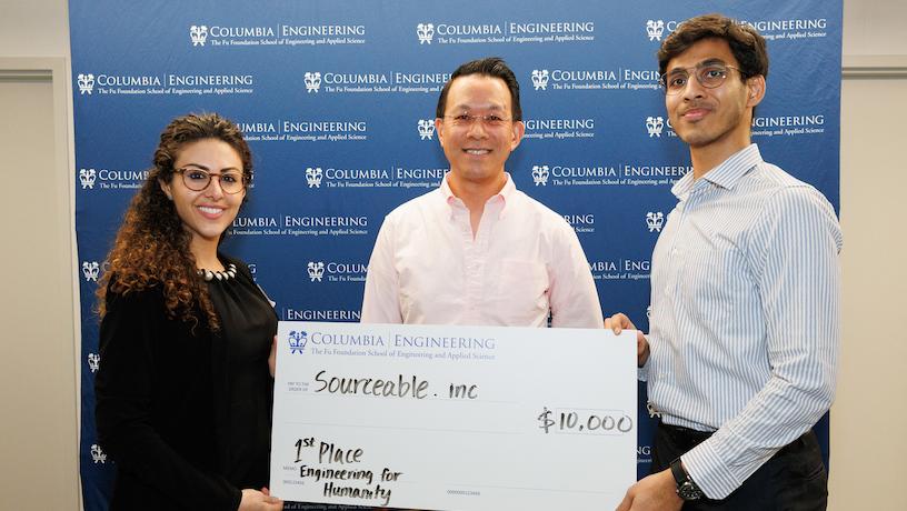 Sourceable team leads Siddhant Kumar and Lena Arkawi accepting their $10,000 first place Engineering for Humanity Award 