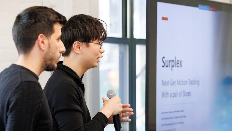 Surplex team leads Axl Chen and Nader Karayanni presenting