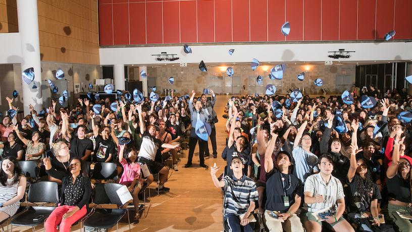 Dean Shih-Fu Chang and Vice Dean of Undergraduate Programs Barclay Morrisson with the Class of 2027 tossing their beanies