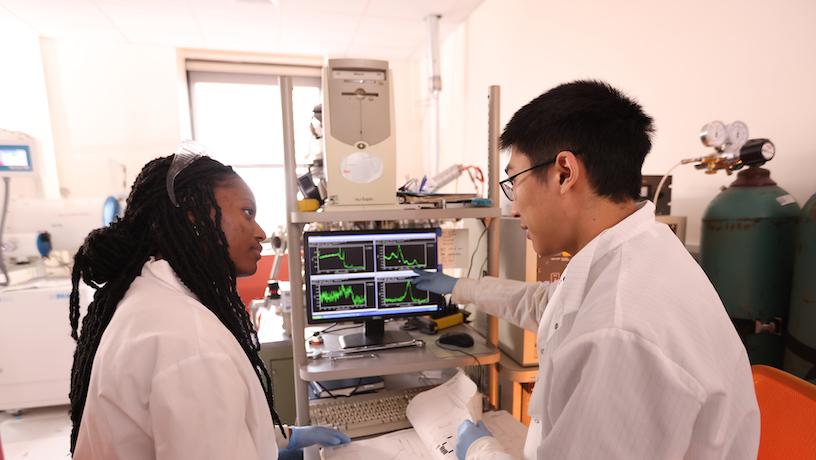 Students reviewing x-ray photoelectron spectroscopy data