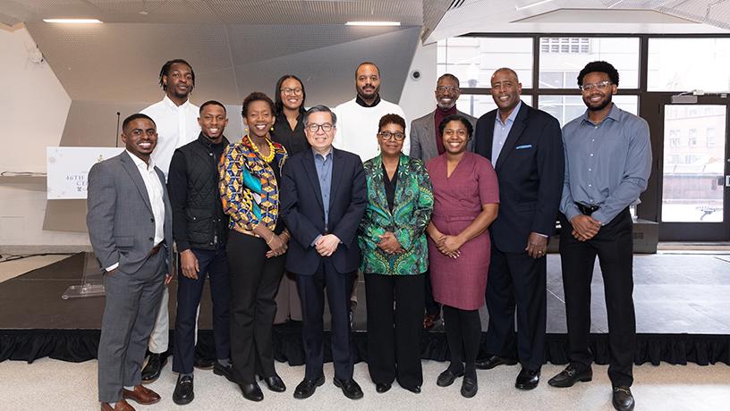 Columbia Engineering Dean Shih-Fu Chang posing for a photo with 11 Columbia NSBE members