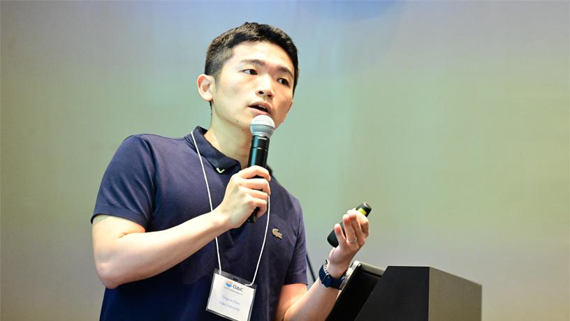 Photo of Tingjun Chen speaking at the CUbiC event