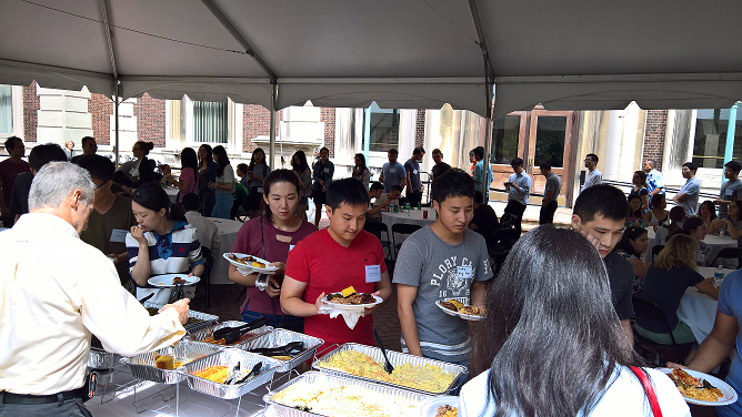 students queing for BBQ